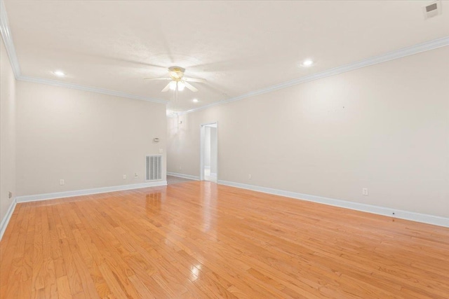 empty room with a ceiling fan, crown molding, light wood-type flooring, baseboards, and recessed lighting