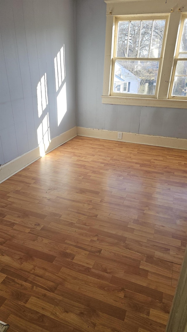 empty room with wood-type flooring