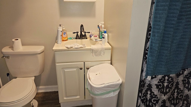 bathroom with toilet and vanity