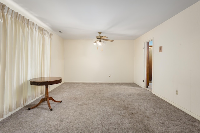 unfurnished room featuring carpet and ceiling fan