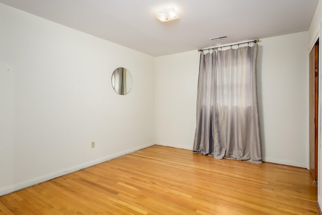 spare room featuring hardwood / wood-style flooring