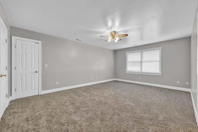 spare room with carpet flooring and ceiling fan