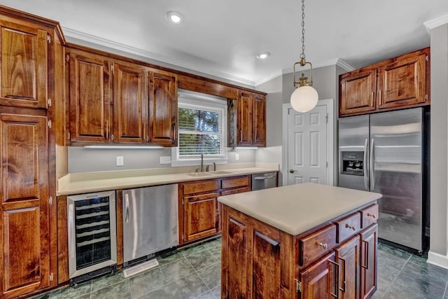 kitchen with sink, a center island, wine cooler, pendant lighting, and appliances with stainless steel finishes