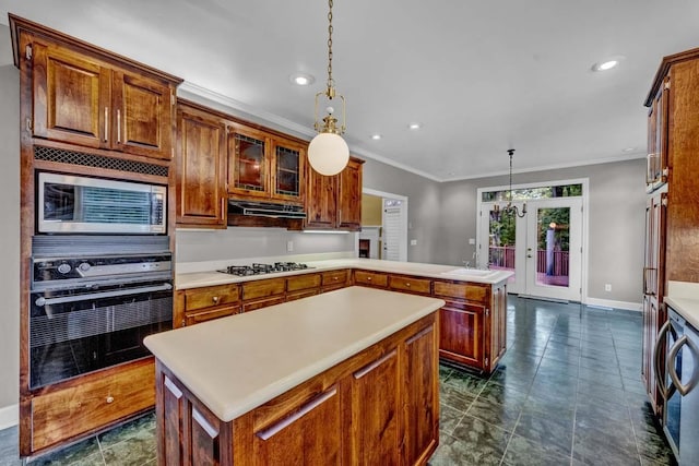 kitchen with kitchen peninsula, appliances with stainless steel finishes, a kitchen island, and hanging light fixtures