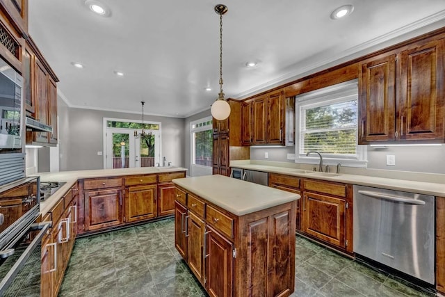 kitchen with french doors, sink, a center island, decorative light fixtures, and appliances with stainless steel finishes