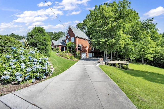 view of front facade featuring a garage and a front lawn