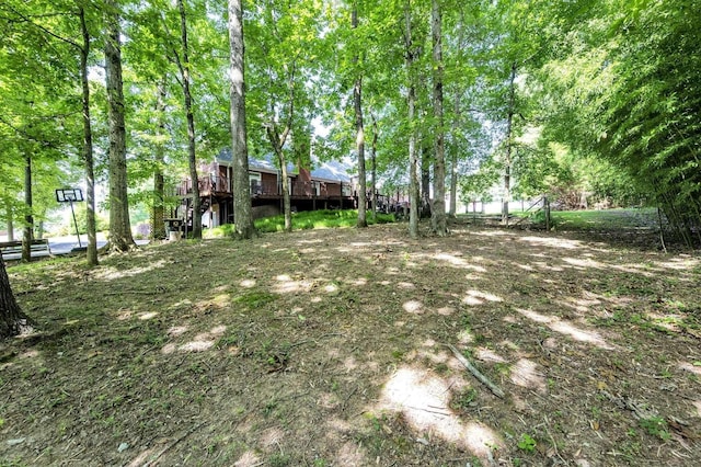 view of yard with a wooden deck