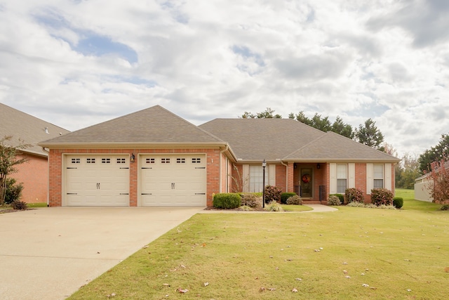 ranch-style house with a garage and a front lawn