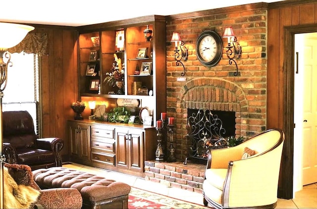 bar featuring light tile patterned flooring, wooden walls, and a brick fireplace