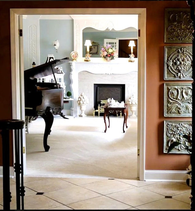 misc room featuring a fireplace and tile patterned flooring