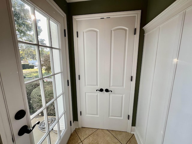 doorway featuring light tile patterned floors