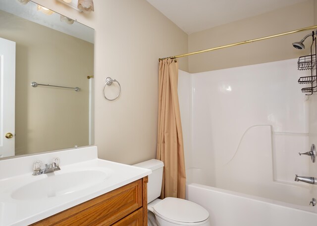 full bathroom featuring shower / tub combo, toilet, and vanity