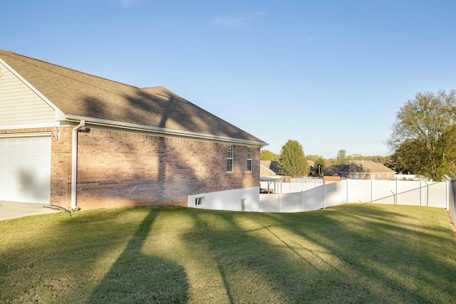 view of home's exterior with a yard