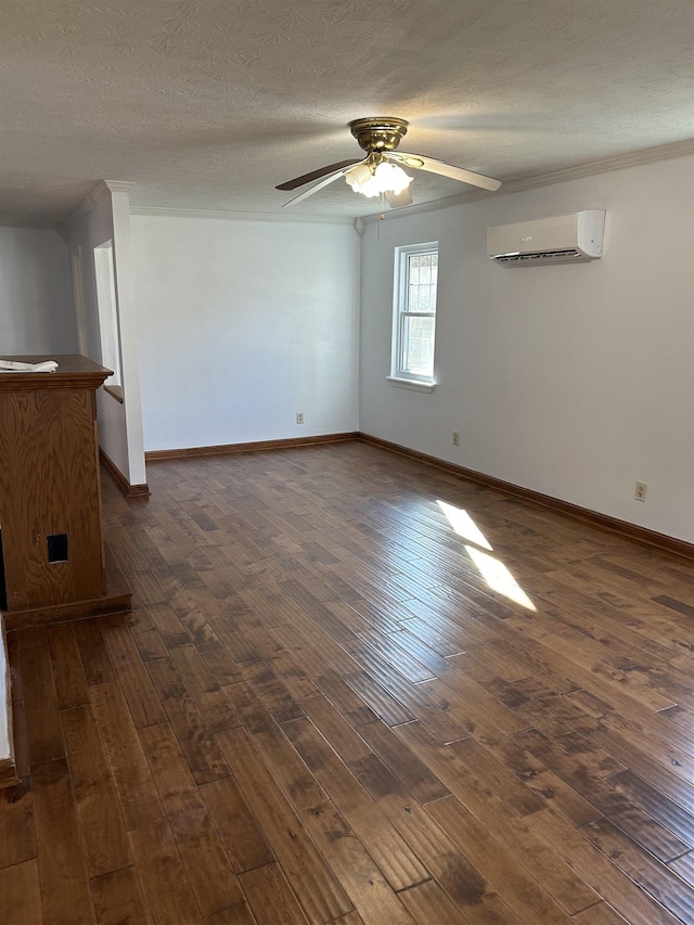 unfurnished room with an AC wall unit, ceiling fan, dark hardwood / wood-style flooring, and a textured ceiling