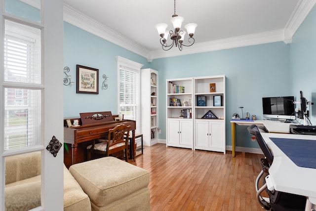 home office with crown molding, baseboards, a chandelier, and light wood-style floors