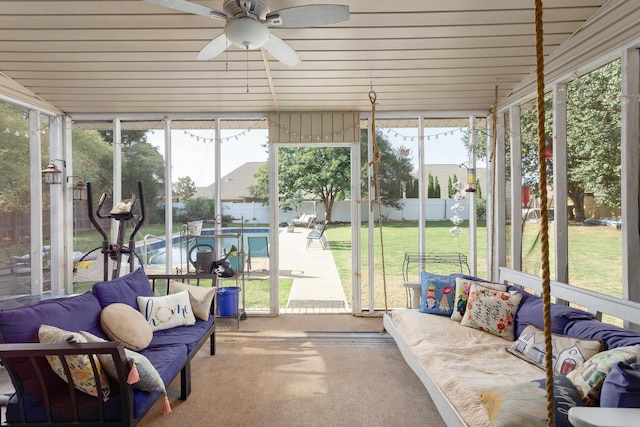 sunroom with a ceiling fan