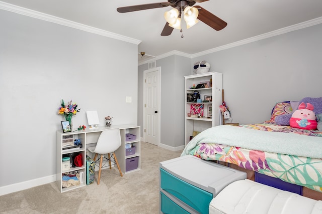 carpeted bedroom with visible vents, ornamental molding, a ceiling fan, and baseboards