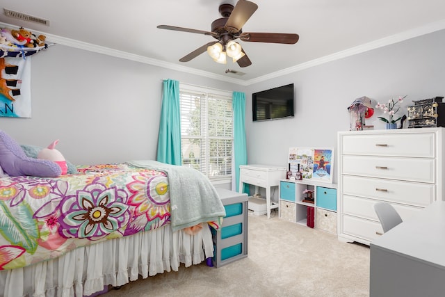 carpeted bedroom featuring ceiling fan, visible vents, and ornamental molding