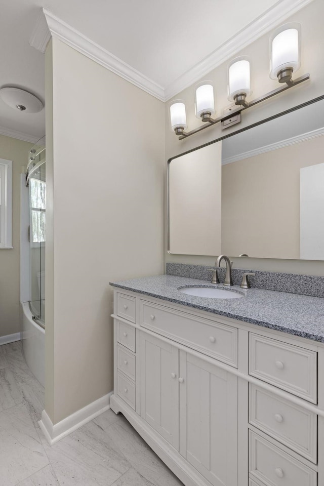 full bathroom with crown molding, marble finish floor, baseboards, and enclosed tub / shower combo