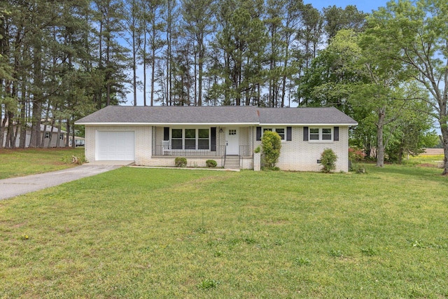 ranch-style home with concrete driveway, brick siding, a front yard, and a garage