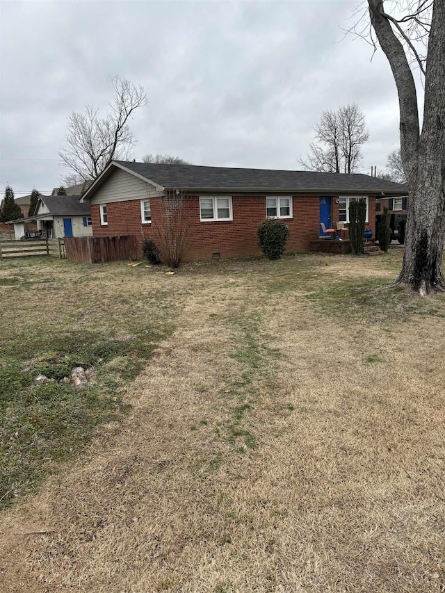 rear view of house with a yard