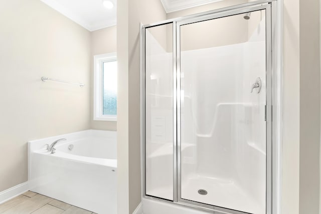 bathroom with crown molding, wood-type flooring, and plus walk in shower