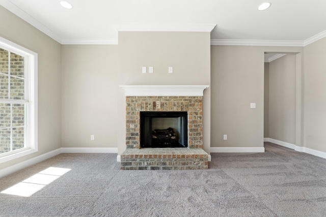 unfurnished living room featuring crown molding, a fireplace, and carpet