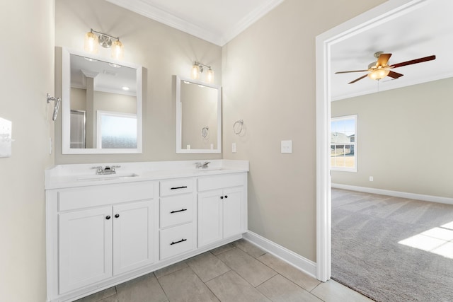 bathroom with ceiling fan, ornamental molding, and vanity