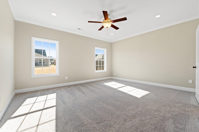 carpeted spare room with crown molding and ceiling fan