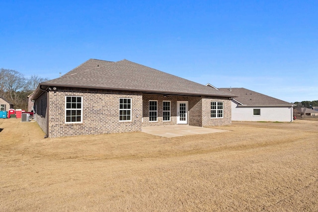 back of house with a patio and a yard