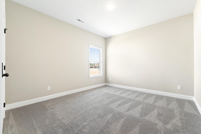 spare room featuring carpet floors