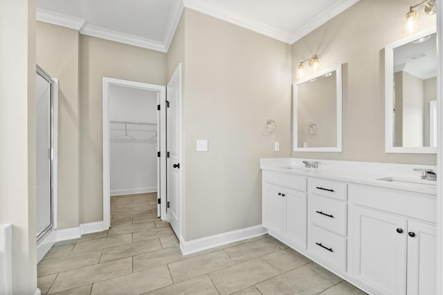 bathroom featuring vanity, crown molding, and a shower with door