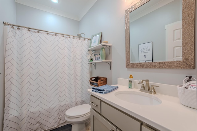 bathroom with curtained shower, crown molding, vanity, and toilet