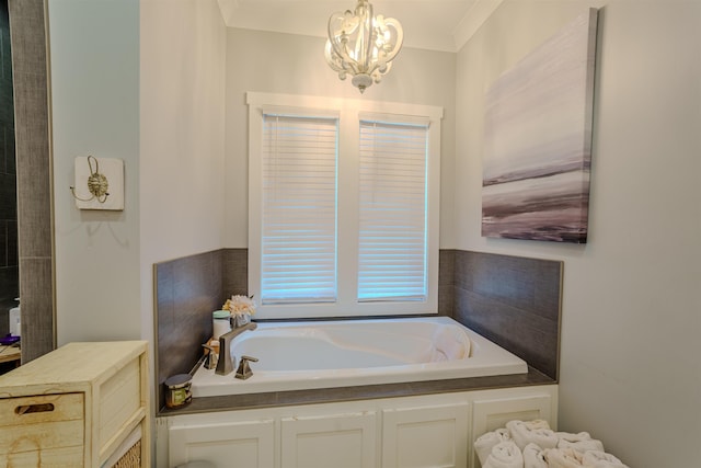 bathroom with a garden tub and a notable chandelier