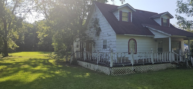 view of front of house with a porch and a front lawn