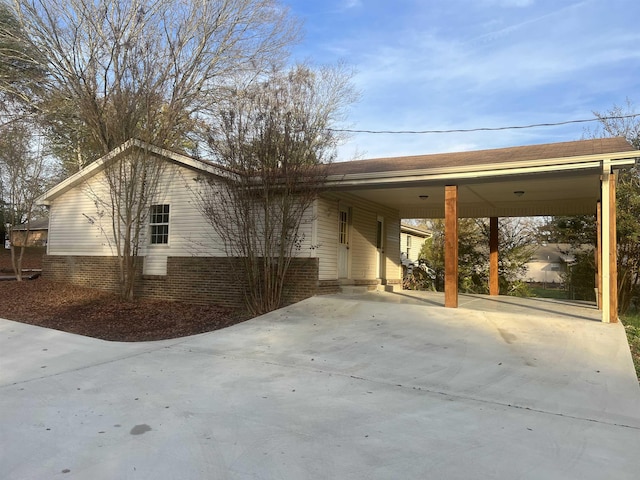 view of side of home featuring a carport