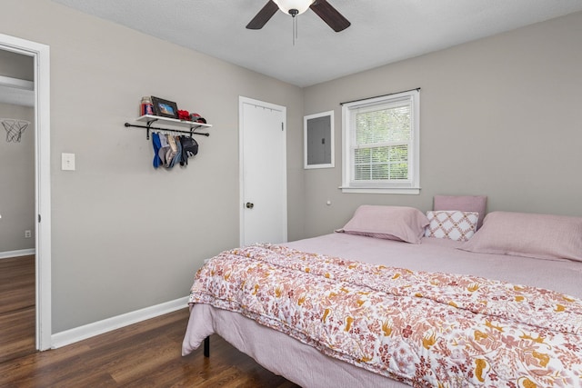  - bedroom featuring dark wood-style floors, electric panel, and ceiling fan