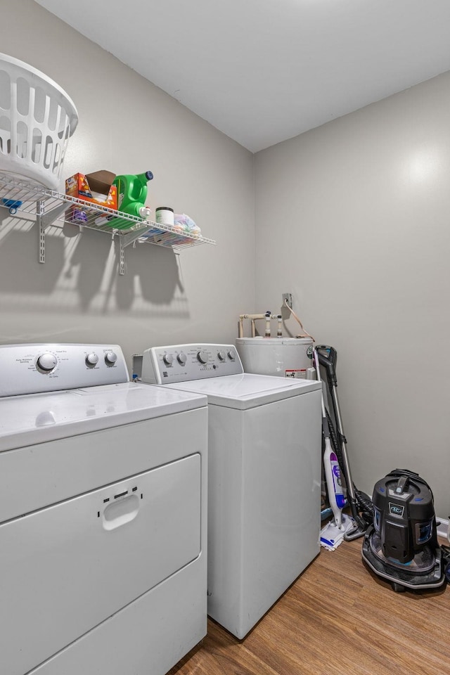  - laundry room with washer and clothes dryer and wood finished floors