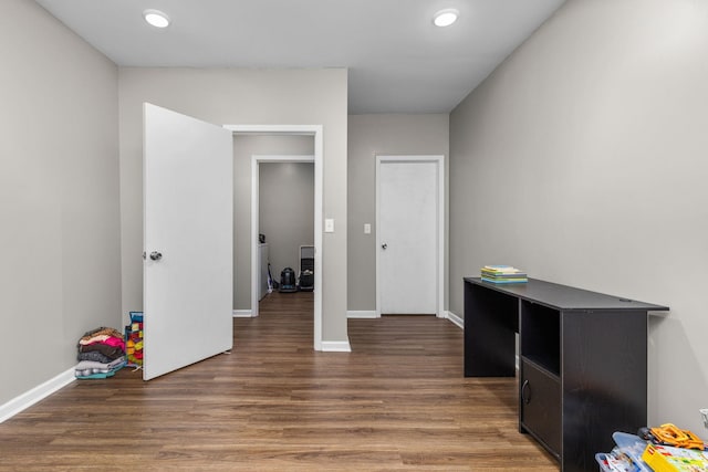  - unfurnished bedroom featuring wood finished floors and recessed lighting