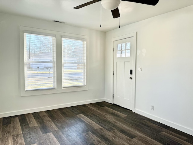 foyer entrance with ceiling fan and dark hardwood / wood-style flooring