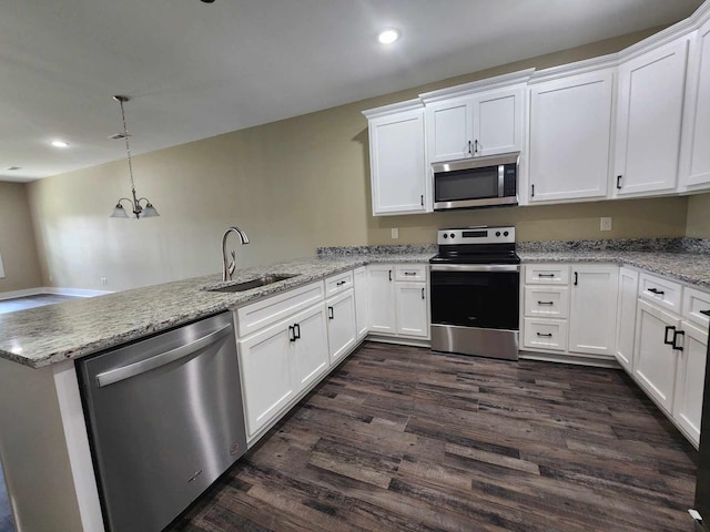 kitchen with white cabinetry, sink, kitchen peninsula, and stainless steel appliances