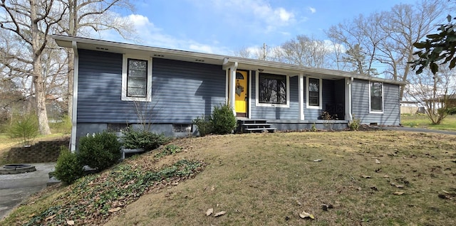 single story home featuring a porch and a front yard