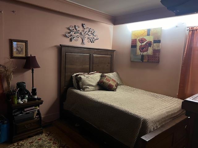 bedroom featuring crown molding