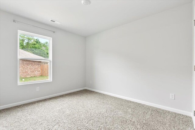  - carpeted spare room featuring baseboards