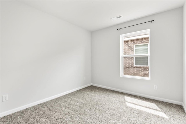  - unfurnished room with baseboards and carpet floors