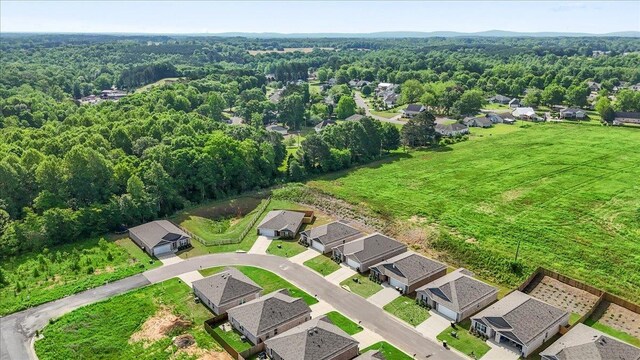  - aerial view of residential area with a forest