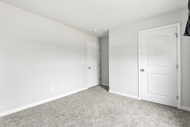  - unfurnished bedroom featuring carpet flooring and baseboards