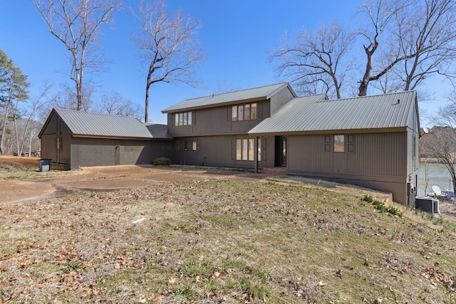 view of front of home with metal roof and central AC unit