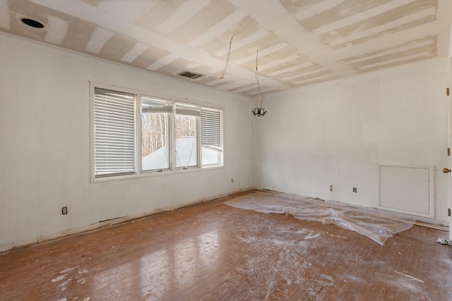 spare room featuring visible vents