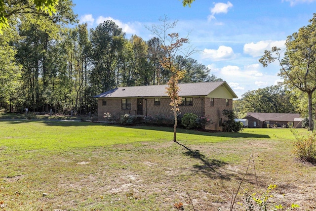 back of property featuring a yard